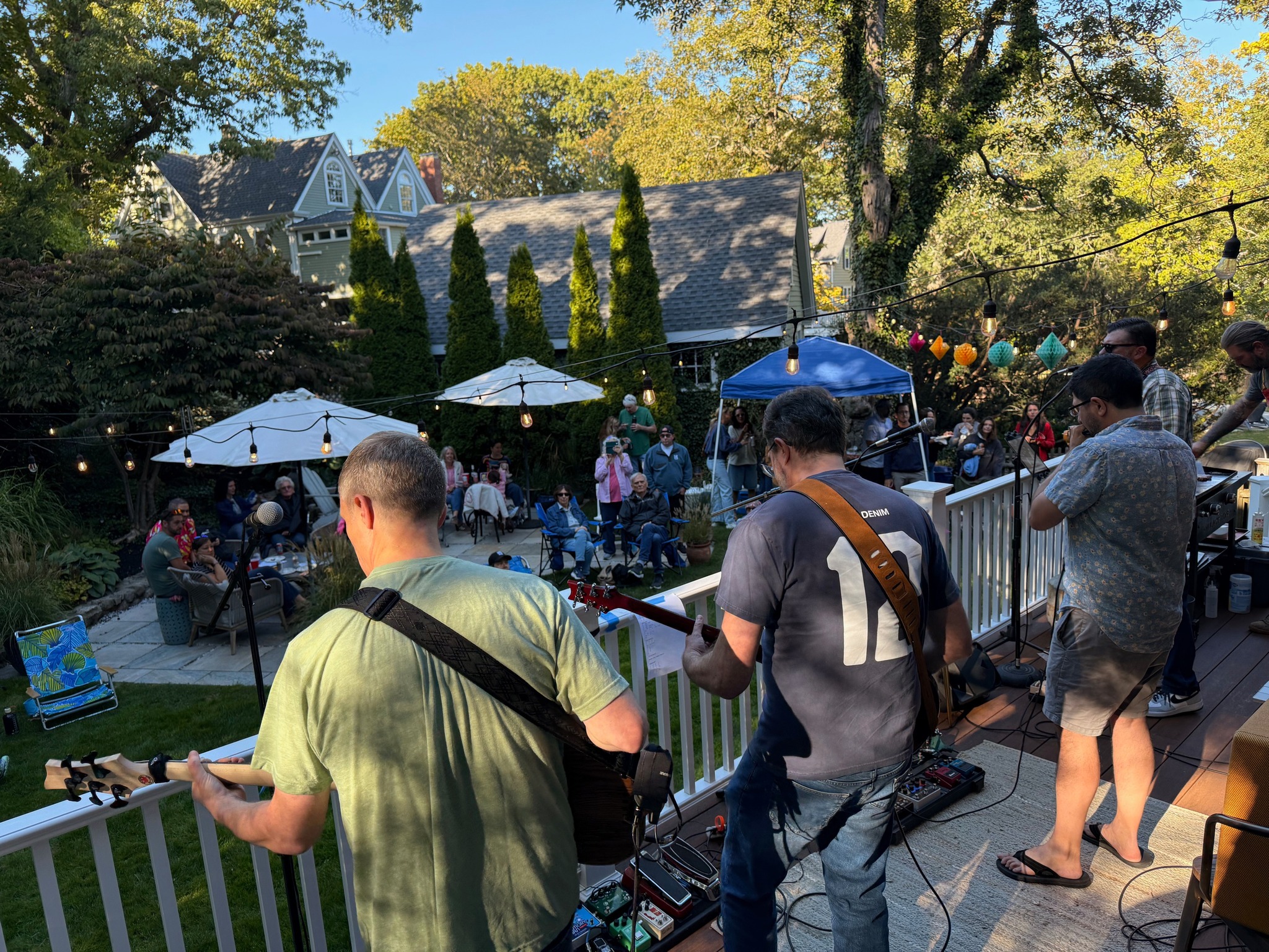 Stage view of a packed outdoor crowd at a Birdface show